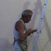 Prof Gilson pintando o logotipo